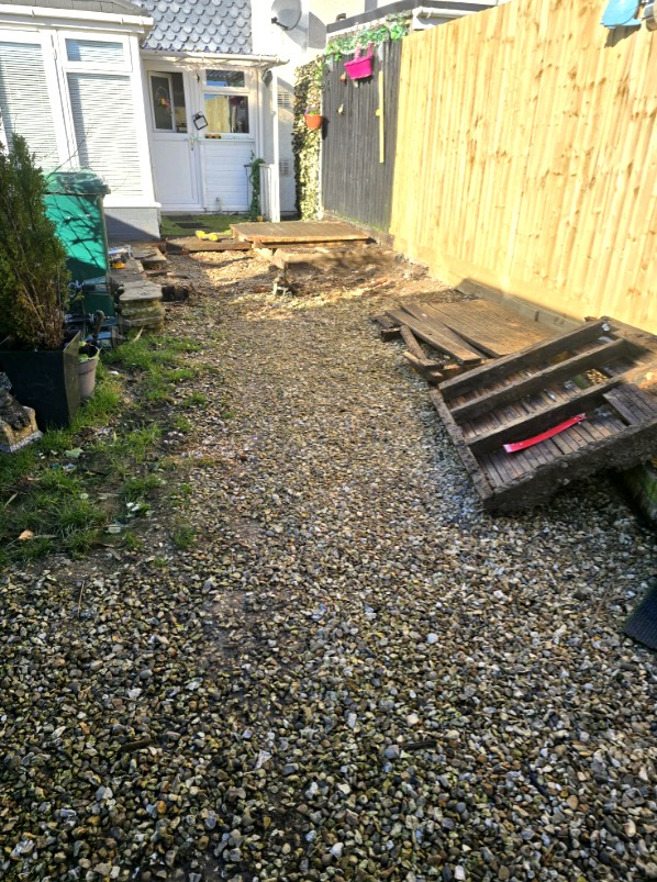 Before – gravel area before deck installation